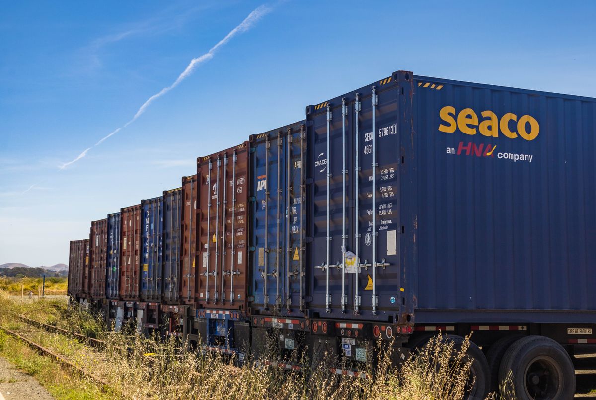 Intermodal containers staged along the rail
